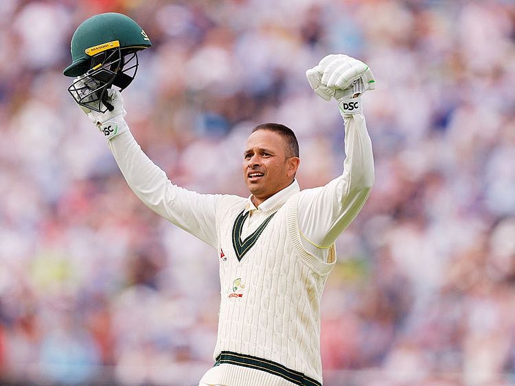 Australia's Usman Khawaja celebrates after reaching his century