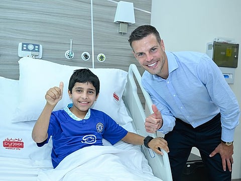 Khalifa Ali Salem Al Mansoori, with Chelsea jersey, meets his idol and Chelsea captain Cesar Azpilicueta in Abu Dhabi.