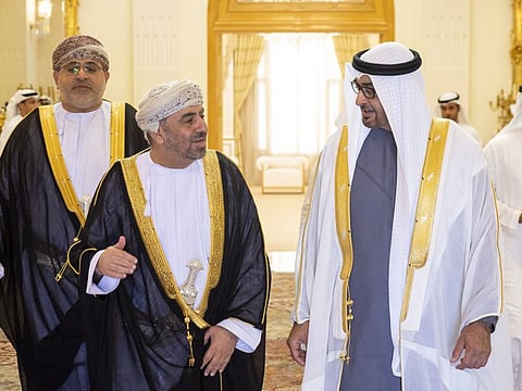 Sheikh Mohamed bin Zayed Al Nahyan, President of the United Arab Emirates (R), speaks with Dr Ahmed bin Hilal bin Saud Al-Busaidi, Ambassador of Oman to the UAE (2nd L) in Abu Dhabi.