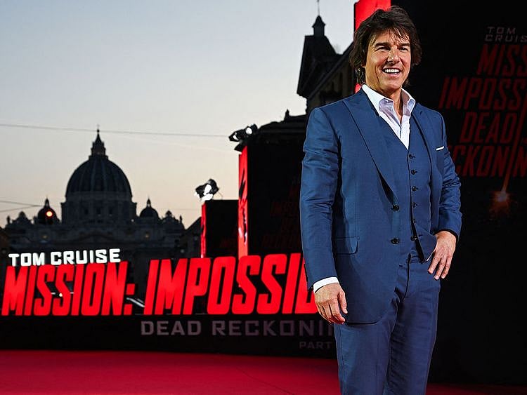 US producer and actor Tom Cruise poses during the premiere of "Mission: Impossible - Dead Reckoning Part One" movie with St. Peter's dome in the back, at Auditorium della Conciliazione in Rome, on June 19, 2023.