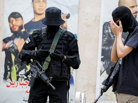Palestinian gunmen pray during the funeral of Amjad Jaas, who was killed in an Israeli raid, in Jenin, in the West Bank, June 20, 2023.  