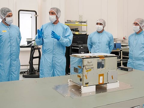 MBRSC team with the satellite 