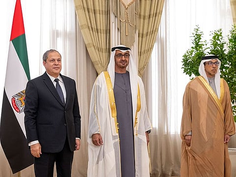 President Sheikh Mohamed bin Zayed Al Nahyan (centre), and Sheikh Mansour bin Zayed Al Nahyan (right), Vice President, with newly appointed judge Miftah Salim Saad (left), during an oath ceremony for newly appointed judges of the Federal Supreme Court