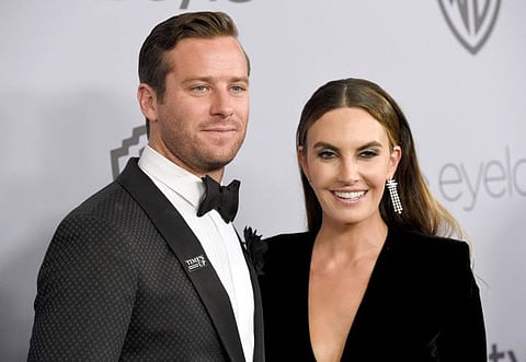 Armie Hammer, left, and wife Elizabeth Chambers.