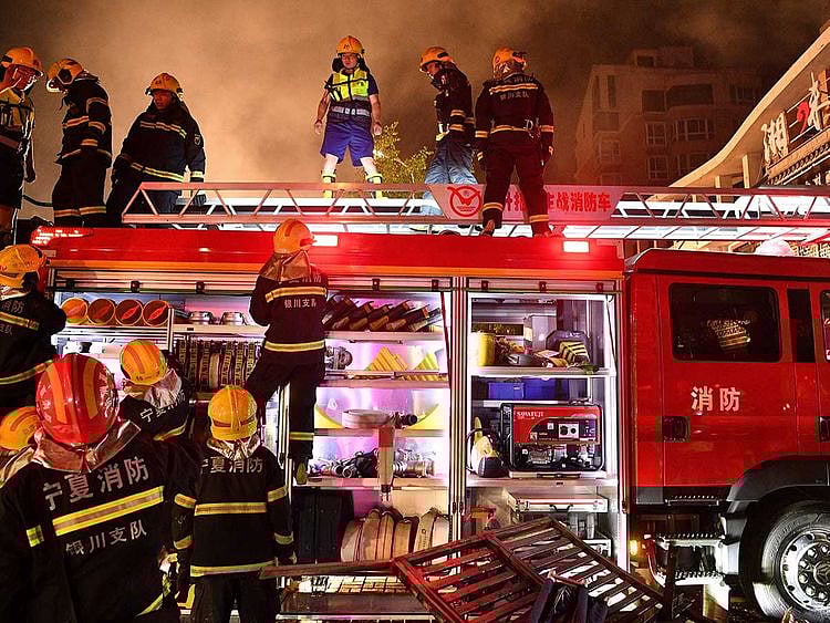 Firefighters work at the site of an explosion at a restaurant in Yinchuan, northwest China's Ningxia Hui Autonomous Region.