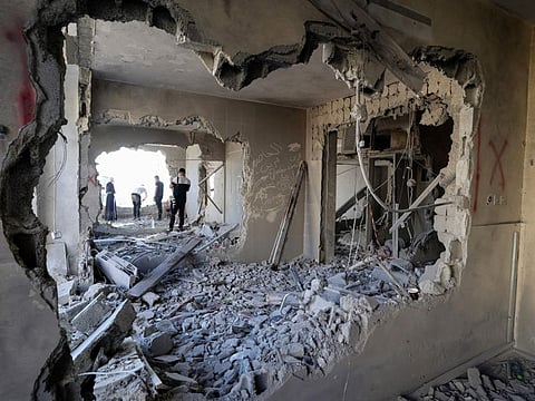 People inspect the demolished house in Nablus on June 22, 2023, after Israeli forces blew up the interior of a house belonging to a Palestinian man imprisoned in Israel.  
