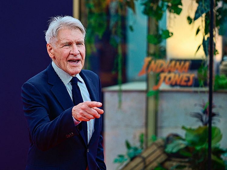 US actor Harrison Ford (C) arrives on the red carpet at the German premiere of Lucasfilm's "Indiana Jones and the Dial of Destiny", at the Zoopalast cinema on June 22, 2023 in Berlin.