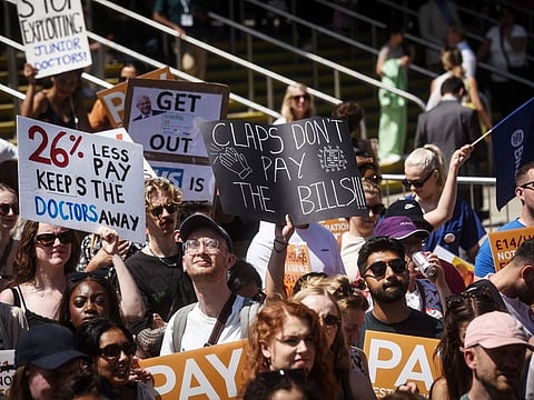Junior doctors protest outside the venue of the NHS ConfedExpo at the Manchester Central Convention Centre, on June 15, 2023. 