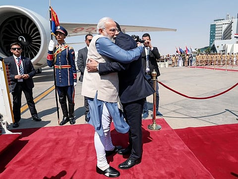Prime Minister Narendra Modi being received by Egyptian PM Mostafa Madbouly on his arrival in Cairo on Saturday.  