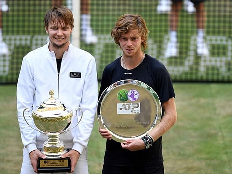 Winner Kazakhstan's Alexander Bublik (left) and second placed Russia's Andrey Rublev pose with their trophies after the final of the ATP 500 Halle Open tournament in Germany on Sunday.