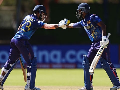 Sadeera Samarawickrama and Dimuth Karunarathana of Sri Lanka celebrate their 150-run partnership during the ICC Cricket World Cup Qualifier at Queen’s Sports Club on Sunday.