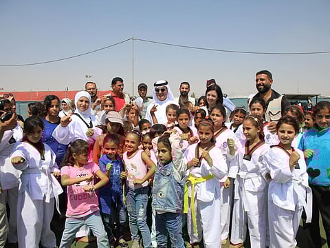 Abdul Aziz Al Ghurair (centre, back row) with children in a file picture