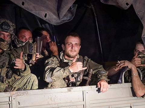  Members of the Wagner Group military company sit in their vehicle on a street in Rostov-on-Don, Russia, Saturday, June 24, 2023