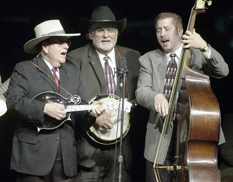 Bluegrass musician Bobby Osborne, left, plays the mandolin; Sonny Osborne, middle, plays the banjo; and Daryl Mosley, on bass, sings 'Kentucky', on April 11, 2002.