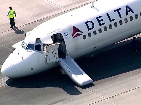 A Delta plane lands without its landing gear at the Charlotte Douglas International Airport, Wednesday, June 28, 2023 in Charlotte