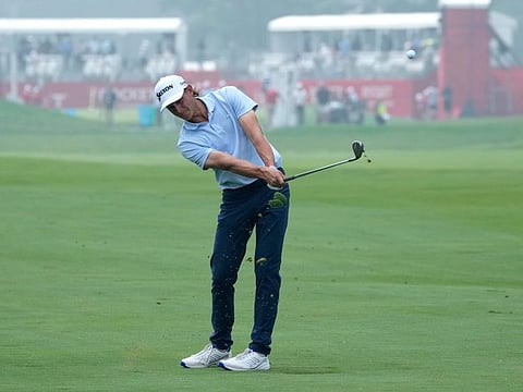 Peter Kuest hits his approach shot onto the 18th green during the first round of the Rocket Mortgage Classic in Detroit on Thursday.