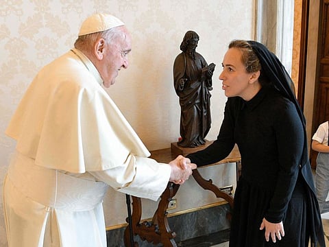 Pope Francis shaking hands with Stella Assange, wife of WikiLeaks founder Julian Assange, during a private audience in the Vatican. 