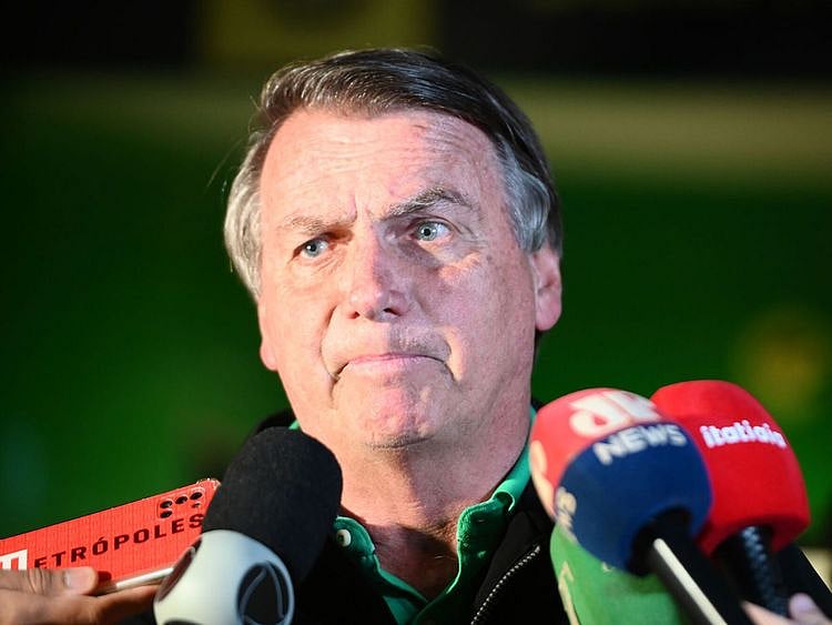 Brazil's former President Jair Bolsonaro talks with media