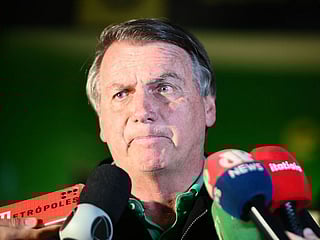 Brazil's former President Jair Bolsonaro talks with media upon his arrival at Brasilia International Airport, in Brasilia. File photo taken on June 30, 2023. 