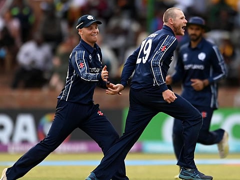 Michael Leask of Scotland celebrates the wicket of Richard Ngarava of Zimbabwe during the ICC Men's Cricket World Cup Qualifier at Queen’s Sports Club in Bulawayo on Tuesday.