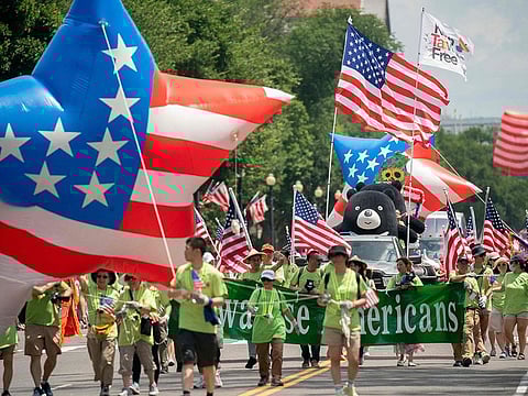 Participants march during the National Independence Day Parade in Washington, DC, on July 4, 2023.