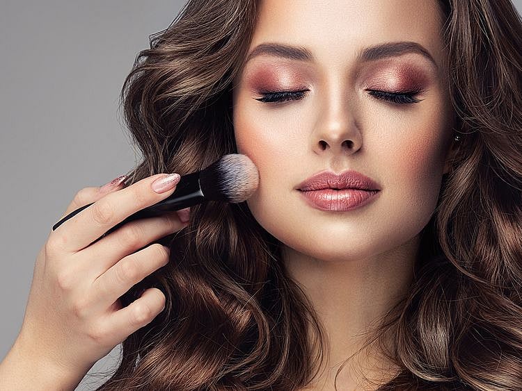 Person applying blush
