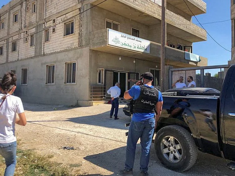 People gather near a mosque where a shooting took place, in Bar Elias, Lebanon July 7, 2023.  