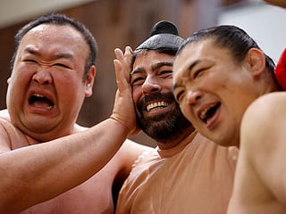 Photos: Sumo retirees play for laughs from tourists flooding back to Japan 
