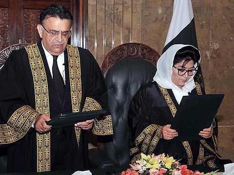 Pakistan’s Chief Justice Umar Ata Bandial administers the oath to Justice Mussarat Hilali as a judge of the Supreme Court on Friday.  