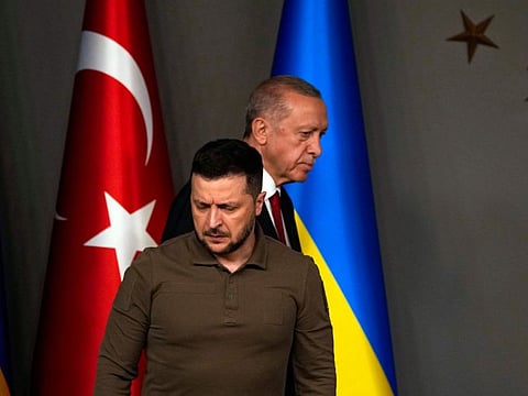 Turkey's President Recep Tayyip Erdogan, rear, and Ukraine's President Volodymyr Zelensky arrive for a joint news conference following their meeting in Istanbul, Turkey, early Saturday, July 8, 2023.  