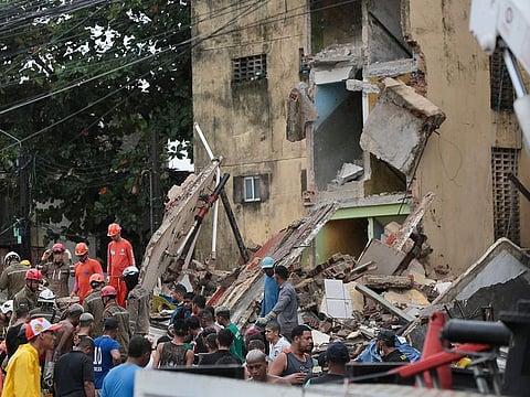 Rescue teams search for victims in the rubble of a collapsed building in the municipality of Paulista, on the outskirts of Recife, in Brazil's northeastern state of Pernambuco. 