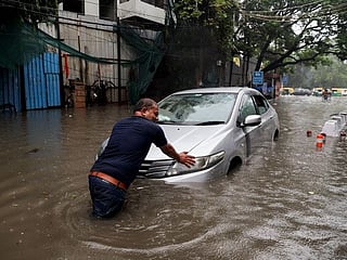 In pictures: Heavy rains in New Delhi and Kerala led to waterlogged roads, houses