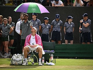 Weather plays spoilsport: Wimbledon and Ashes Test under the rain spell - in pictures