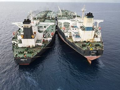 The Iranian-flagged Very Large Crude Carrier (VLCC), MT Arman 114, and the Cameroon-flagged MT S Tinos, are seen as they were spotted conducting a ship-to-ship oil transfer without a permit, according to Indonesia's Maritime Security Agency (Bakamla), near Indonesia's North Natuna Sea, Indonesia, July 7, 2023 in this handout picture released July 11.  