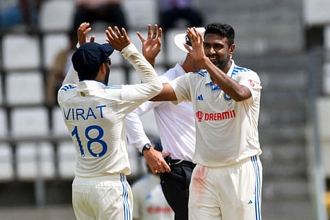 Ravichandran Ashwin (right) and Virat Kohli of India celebrate the dismissal of Alzarri Joseph of West Indies during day one of the First Test between West Indies and India at Windsor Park in Roseau, Dominica, on Wednesday.