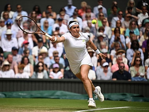 Tunisia's Ons Jabeur in action during her quarter-final match against Kazakhstan's Elena Rybakina at the All England Lawn Tennis and Croquet Club in London on Wednesday.