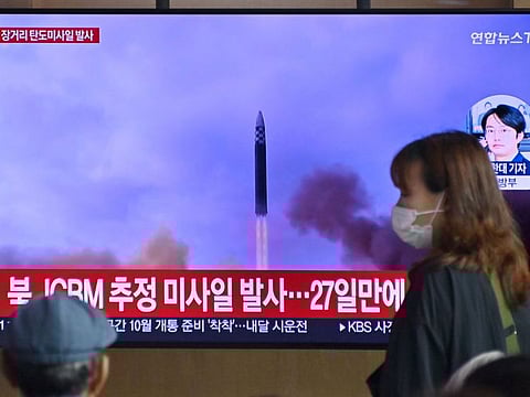 A news broadcast with file footage of a North Korean missile test, at a railway station in Seoul on July 12, 2023.  