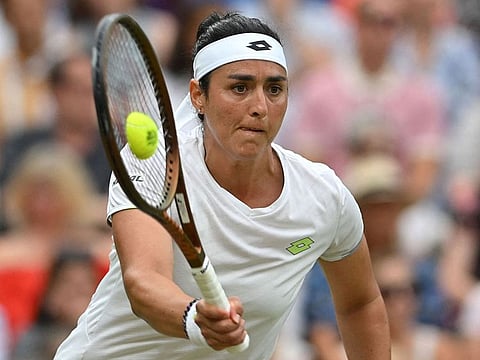 Tunisia's Ons Jabeur returns the ball to Belarus' Aryna Sabalenka during their women's singles semi-finals tennis match.