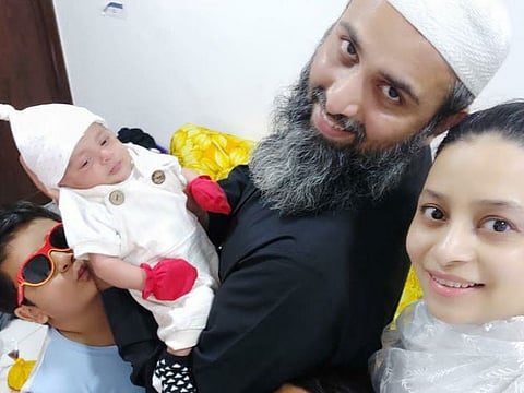Sumbul Anm Khan (right), 31, has defied all odds and is now a happy mother of three. Her latest pregnancy was found after a car accident in the UAE, in which she suffered head injuries that required 11 stitches. Photo shows her with husband Danish Anwar Khan and their children, including the newborn Huzaifa. 