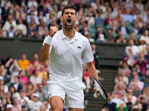 Serbia's Novak Djokovic celebrates after winning a point against Russia's Andrey Rublev in Wimbledon championships on Tuesday.