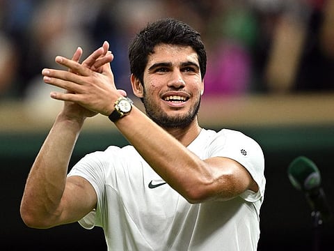 Spain's Carlos Alcaraz celebrates winning against Russia's Daniil Medvedev during their Wimbledon men's singles semi-finals at The All England Lawn Tennis Club in Wimbledon, southwest London, on July 14, 2023.