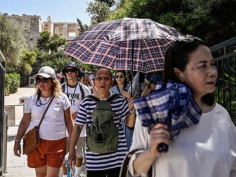 In Pictures: Record heatwaves sweep across Europe and US
