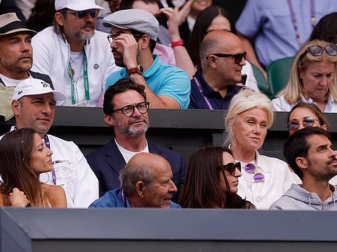 Actor Hugh Jackman and Deborra-Lee Furness in the stands during the men's singles final. 