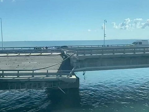 A view shows the section of a road split and sloping to one side following an alleged attack on the Crimea Bridge, that connects the Russian mainland with the Crimean peninsula across the Kerch Strait, in this still image taken from video released July 17, 2023.