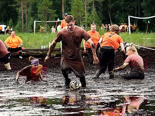 Photos: Swamp soccer world cup sees teams clash in knee-deep mud