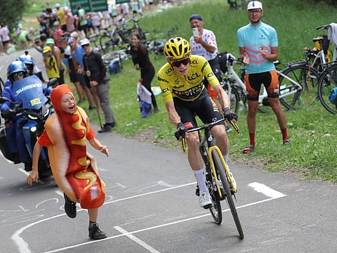 Jumbo-Visma's Danish rider Jonas Vingegaard wearing the overall leader's yellow jersey cycles in the ascent of Col de la Loze during the 17th stage of the 110th edition of the Tour de France race in the French Alps on Wednesday.