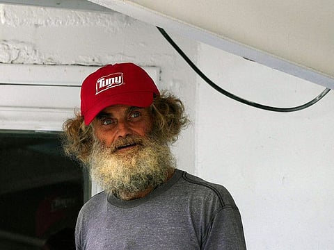 Australian Timothy Lyndsay Shaddock looks out from the tuna boat "Maria Delia" that rescued him and his dog Bella, as he arrives to port in Manzanillo, Mexico, Tuesday, July 18, 2023.