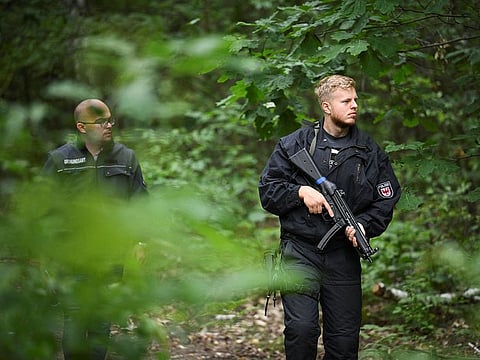 Police officers search, after they warned the public that a suspected lioness was on the loose, in Kleinmachnow, Germany July 21, 2023. 