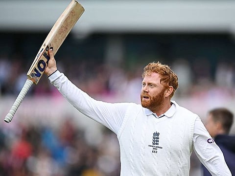 England's Jonny Bairstow raises his bat to the crowd as he leaves the field unbeaten on 99 on day three of the fourth Ashes Test against Australia at Old Trafford cricket ground in Manchester, on July 21, 2023.