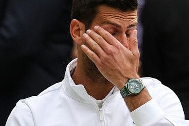Serbia's Novak Djokovic reacts to his defeat by Spain's Carlos Alcaraz during their men's singles final at The All England Tennis Club in Wimbledon on July 16.